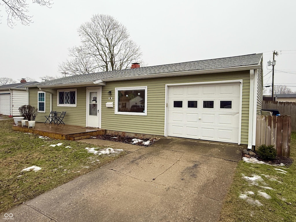 single story home featuring a garage