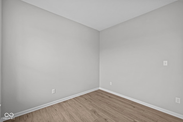 unfurnished room with light wood-type flooring