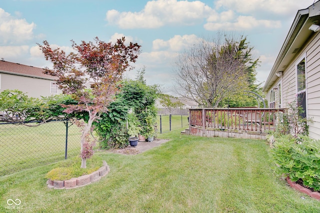 view of yard with a wooden deck