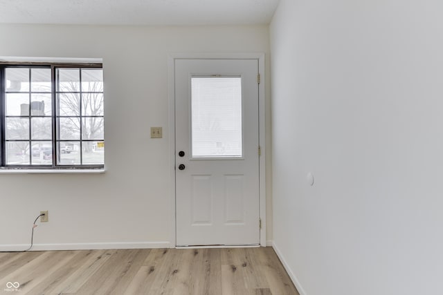 doorway to outside featuring light wood-type flooring