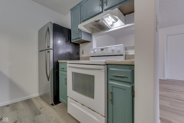 kitchen with stainless steel refrigerator, light hardwood / wood-style flooring, a textured ceiling, and white range with electric cooktop