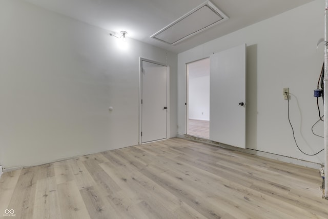 spare room with light wood-type flooring