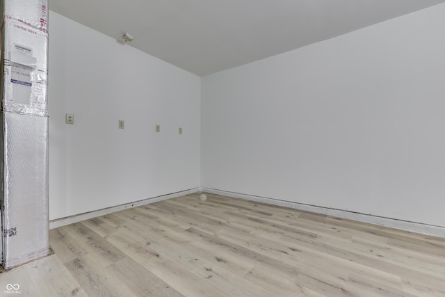 empty room with light hardwood / wood-style floors