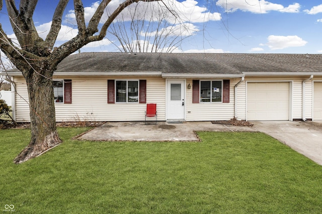 ranch-style home with a garage and a front yard