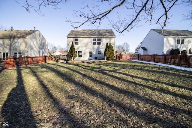 back of house with a patio area and a lawn