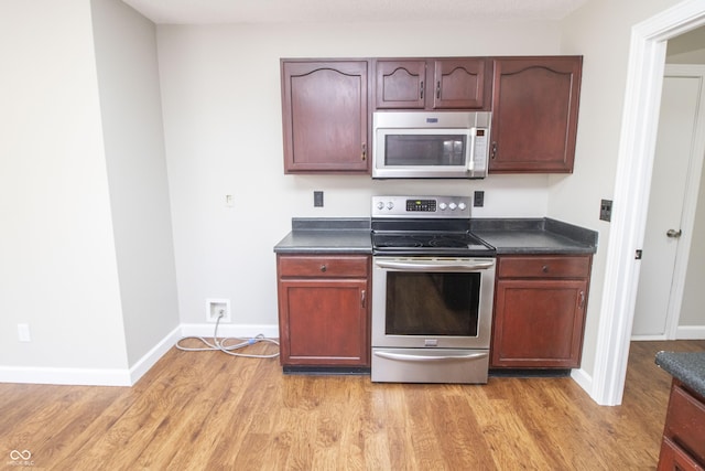 kitchen featuring stainless steel appliances and light wood-type flooring