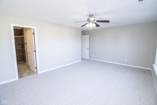 empty room featuring light carpet and ceiling fan