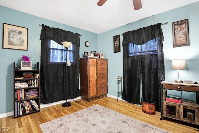 interior space with hardwood / wood-style flooring and ceiling fan