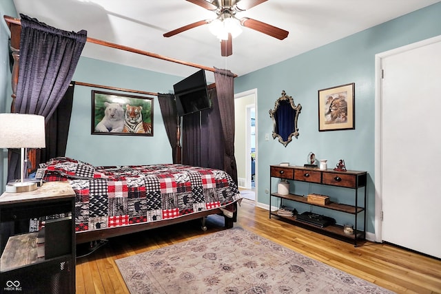 bedroom featuring hardwood / wood-style floors and ceiling fan