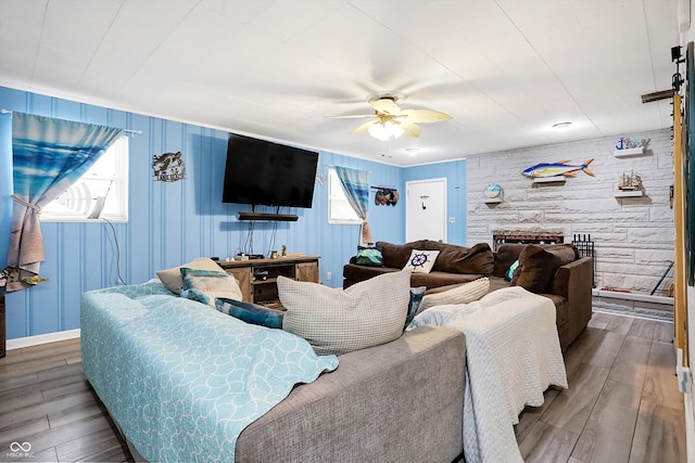 living room with hardwood / wood-style flooring and ceiling fan