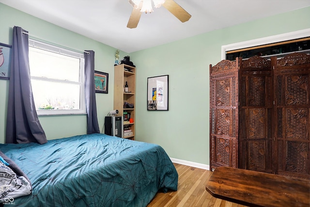 bedroom featuring ceiling fan and light wood-type flooring