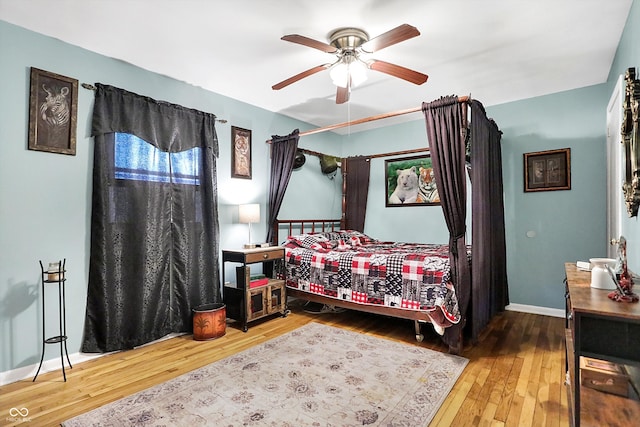 bedroom featuring hardwood / wood-style flooring and ceiling fan