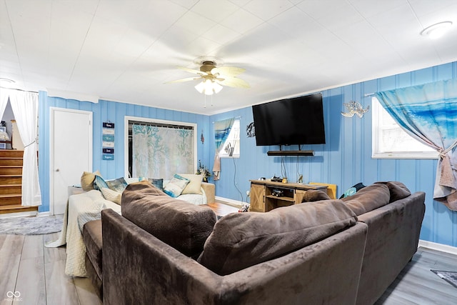 living room with ceiling fan, hardwood / wood-style floors, and a wealth of natural light