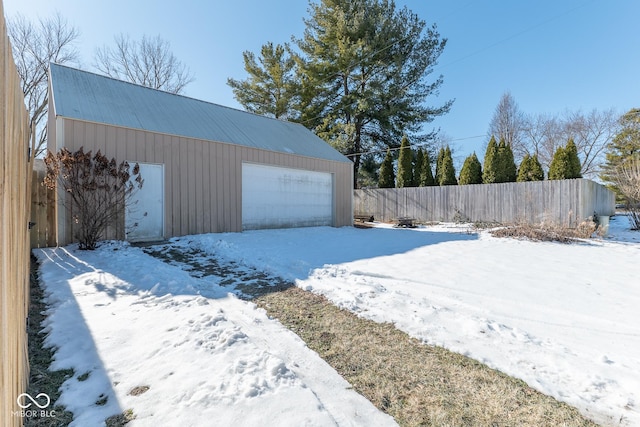 view of snow covered garage