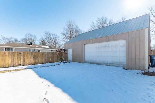 view of snow covered garage