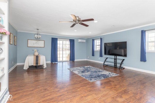 living room featuring dark wood-type flooring, plenty of natural light, crown molding, and ceiling fan with notable chandelier