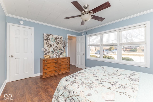 bedroom with crown molding, ceiling fan, dark hardwood / wood-style flooring, and multiple windows