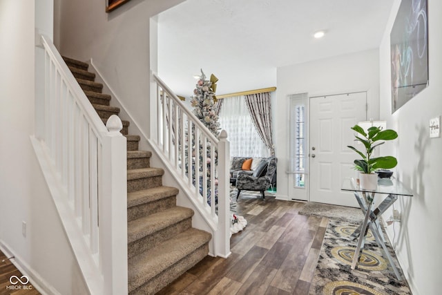 foyer entrance with dark hardwood / wood-style flooring