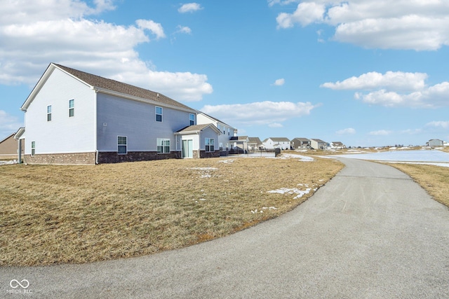 view of home's exterior with a yard