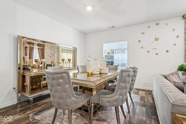 dining room featuring dark hardwood / wood-style flooring