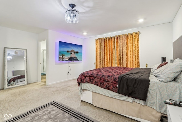 bedroom with carpet floors and a chandelier