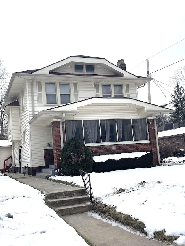 view of front facade featuring a sunroom