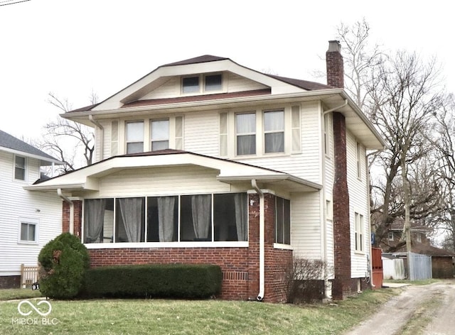 917 E 34th St, Indianapolis, IN 46205 - view of front facade featuring brick siding and a chimney