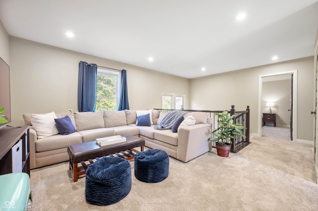 living room featuring light carpet