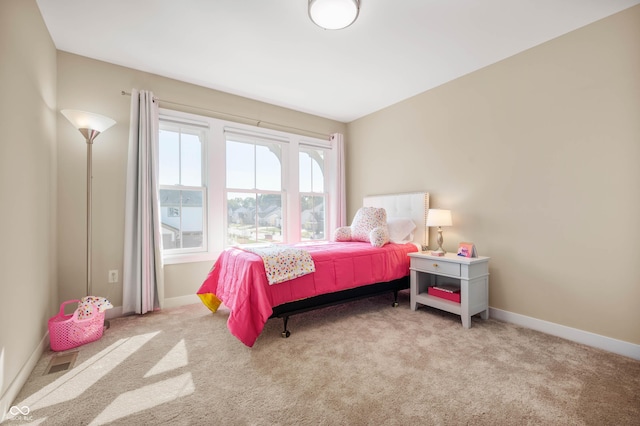 bedroom with light colored carpet