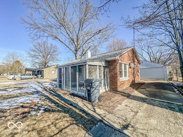 view of front of home with a sunroom