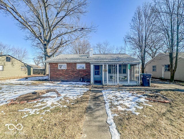 view of front of house featuring a sunroom