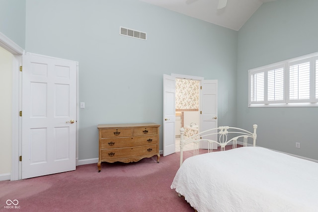 carpeted bedroom with connected bathroom, high vaulted ceiling, and ceiling fan