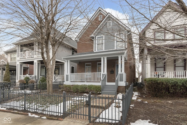 view of property with central AC unit and a porch