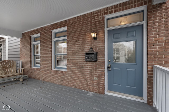 doorway to property featuring covered porch