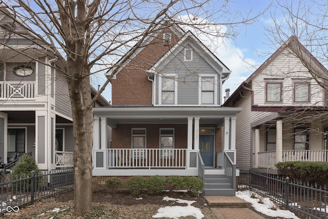 view of property featuring covered porch