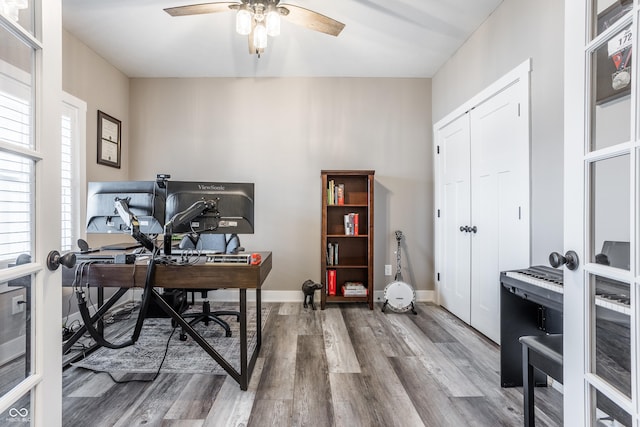 home office featuring hardwood / wood-style flooring and ceiling fan