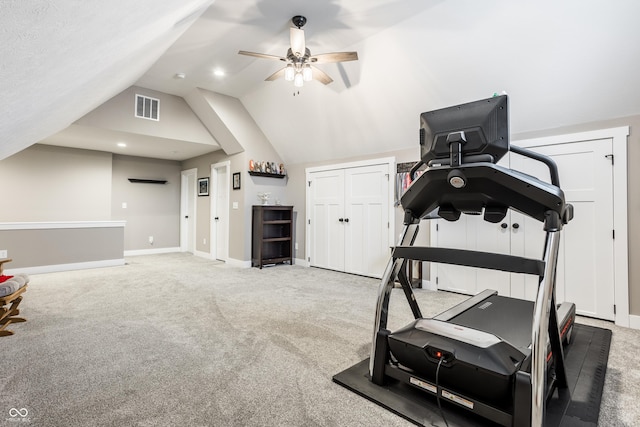 workout room with vaulted ceiling, carpet flooring, and ceiling fan