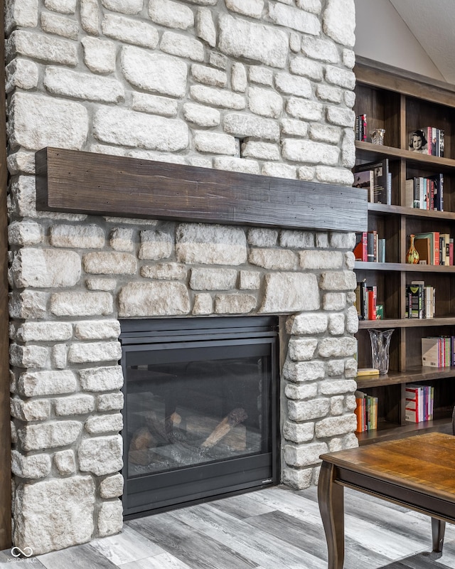 room details featuring wood-type flooring and a fireplace