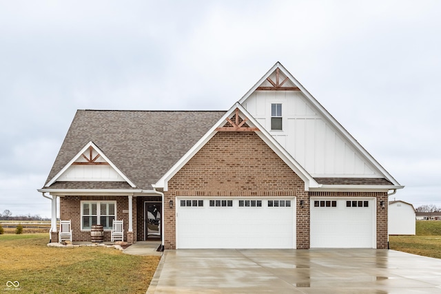 craftsman house with a garage and a front yard