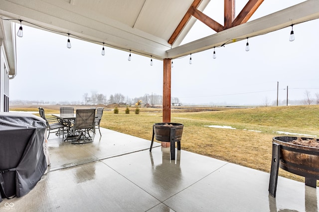 view of patio / terrace featuring a grill and a rural view