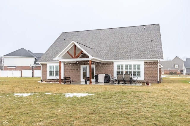 back of house featuring a yard and a patio