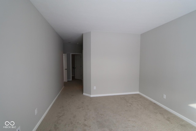 unfurnished room featuring light colored carpet