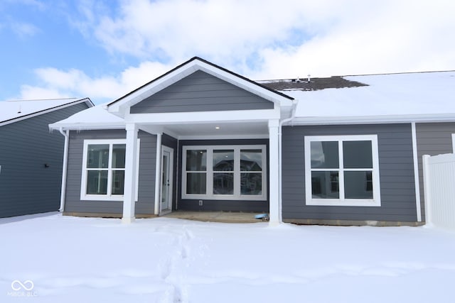 view of snow covered house