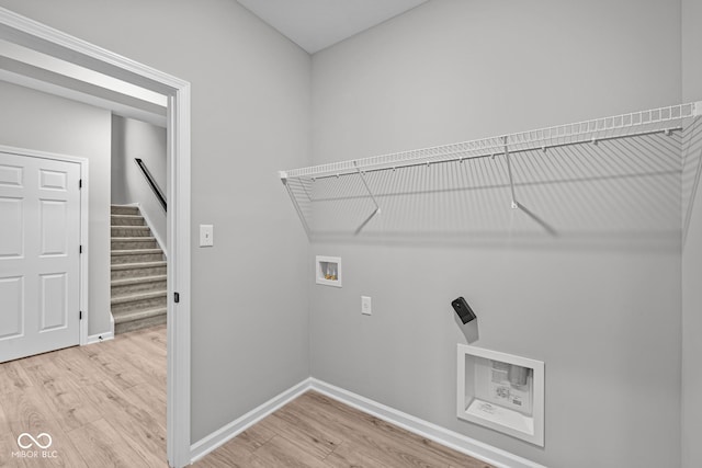 laundry room featuring hardwood / wood-style flooring, hookup for a washing machine, and electric dryer hookup