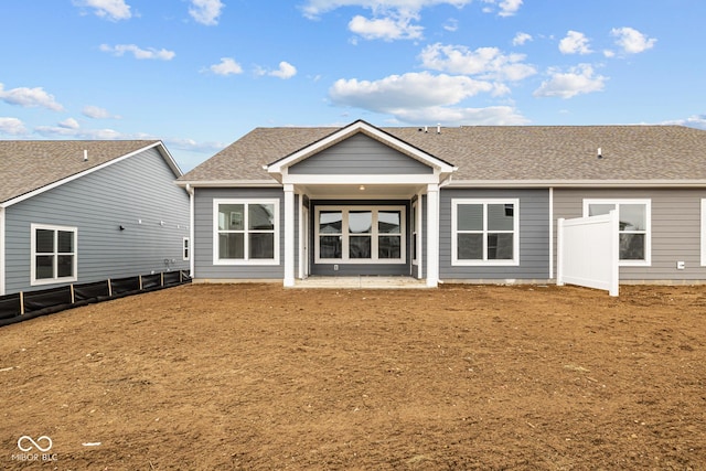 back of house with a patio and a yard