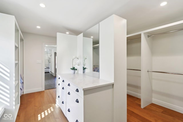 spacious closet featuring light wood-type flooring