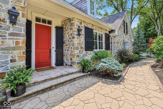 7837 Dean Rd, Indianapolis, IN 46240 - view of exterior entry with stone siding and roof with shingles