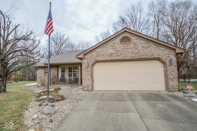 single story home featuring a garage and a porch