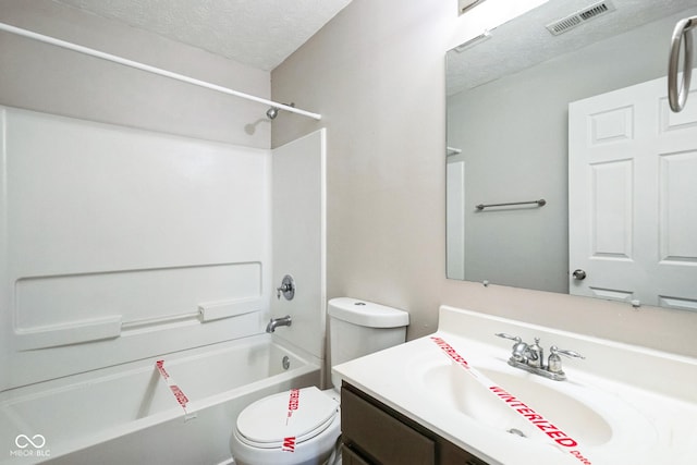 full bathroom featuring vanity, toilet, shower / bathing tub combination, and a textured ceiling