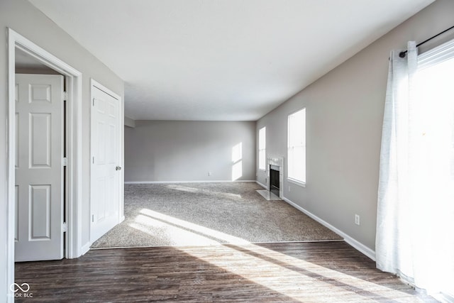 empty room featuring dark hardwood / wood-style flooring